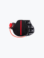 Motorcycle air seat cushion with black cover, red stripe, and attached hand pump