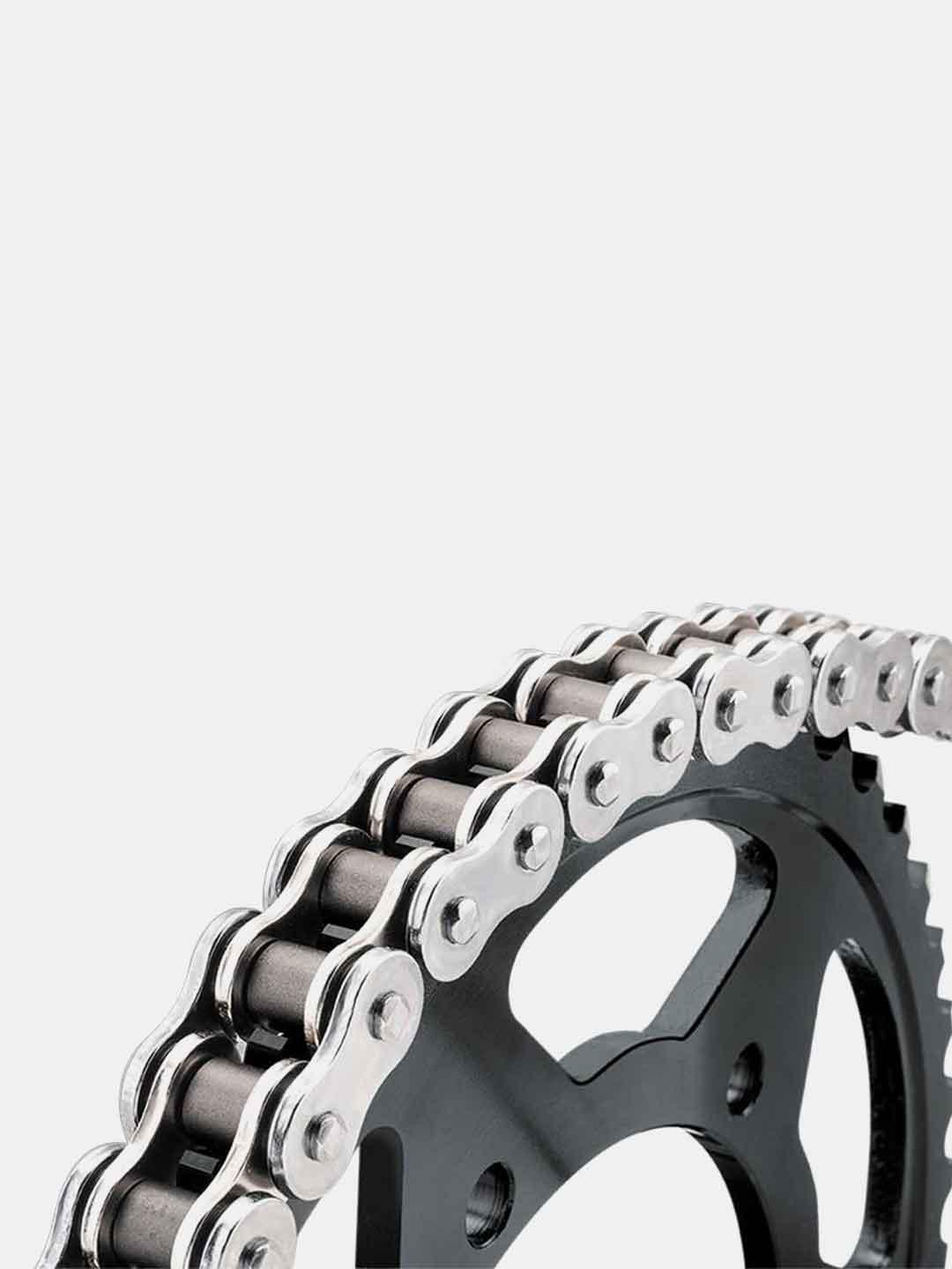Motorcycle chain and sprocket close-up on white background