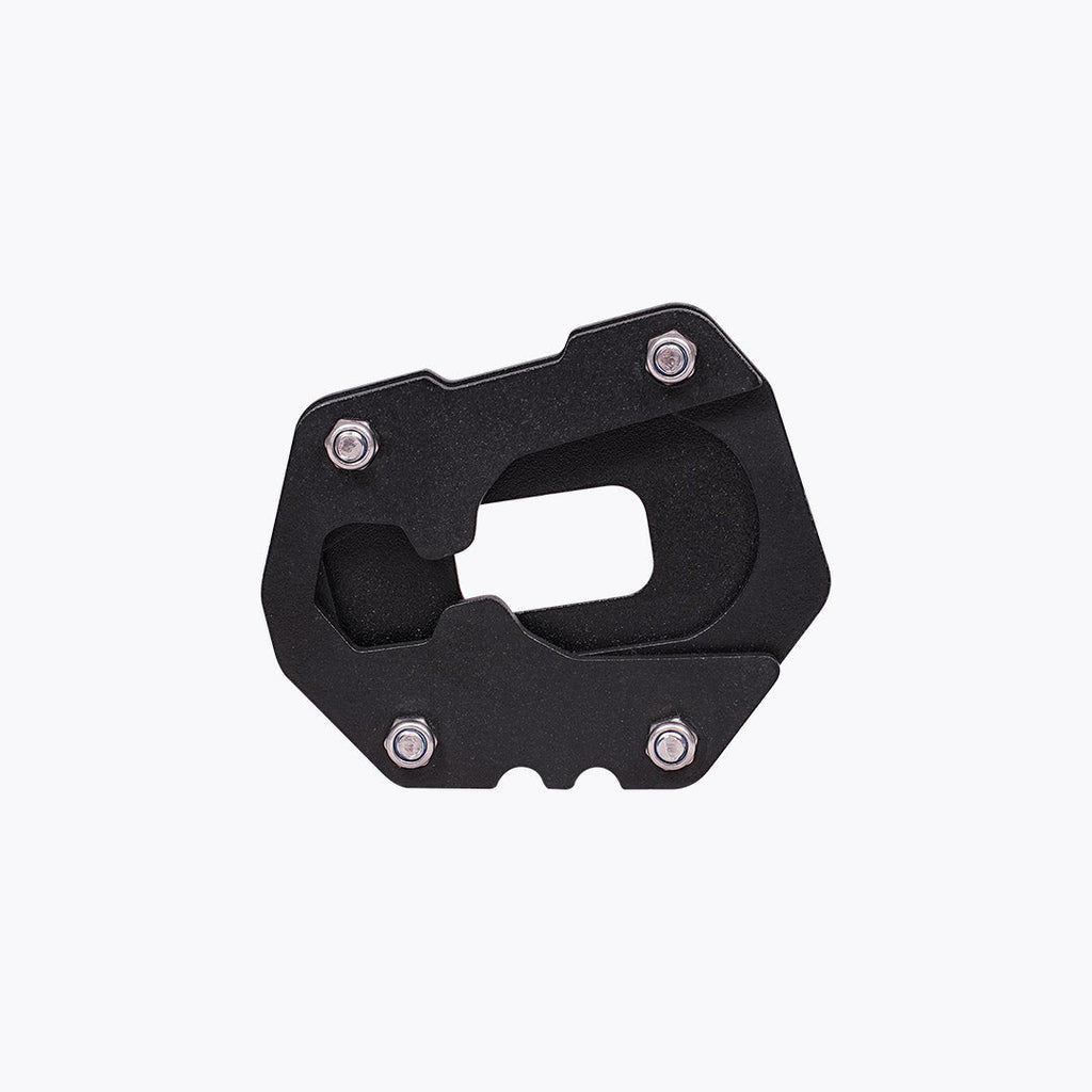 Black motorcycle side stand base plate with metal bolts on white background