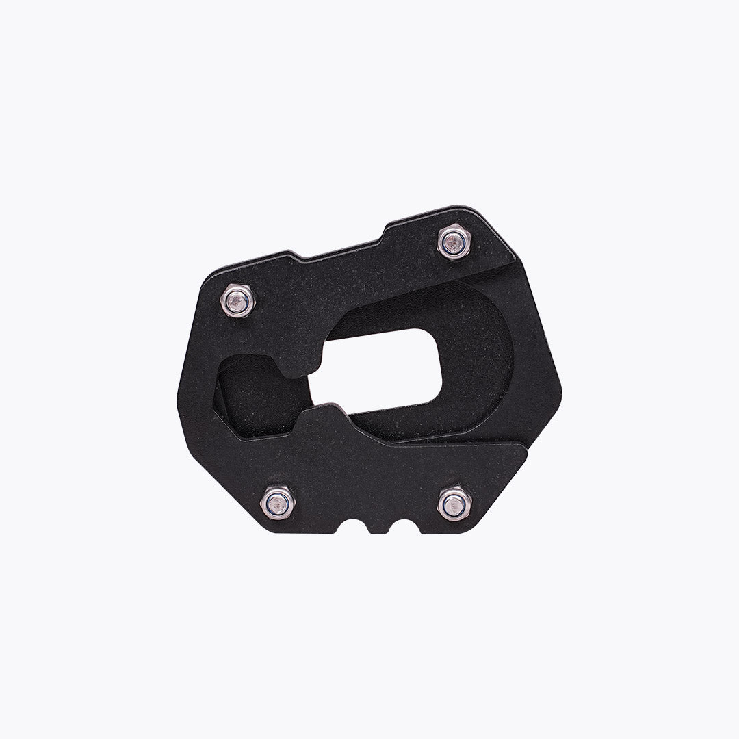 Black motorcycle side stand base plate with metal bolts on white background