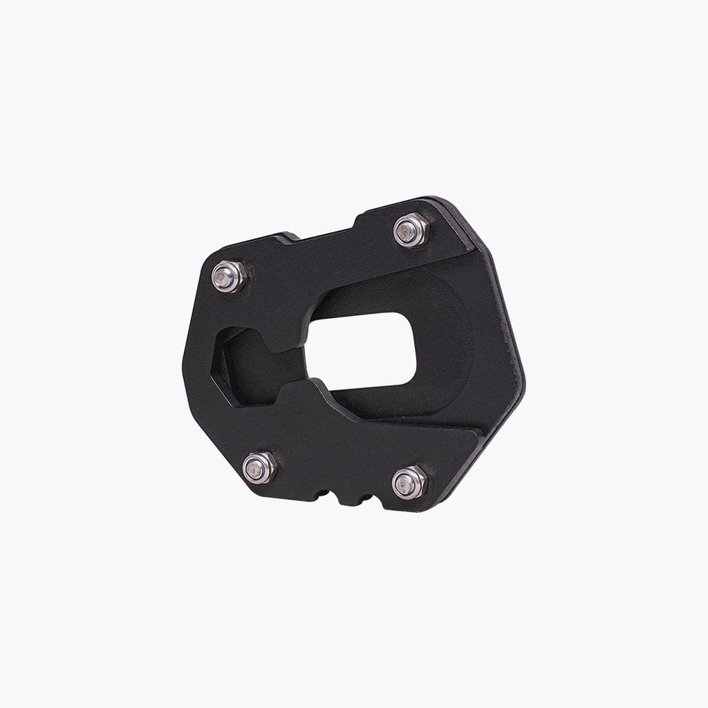 Black motorcycle side stand base plate with mounting bolts on white background