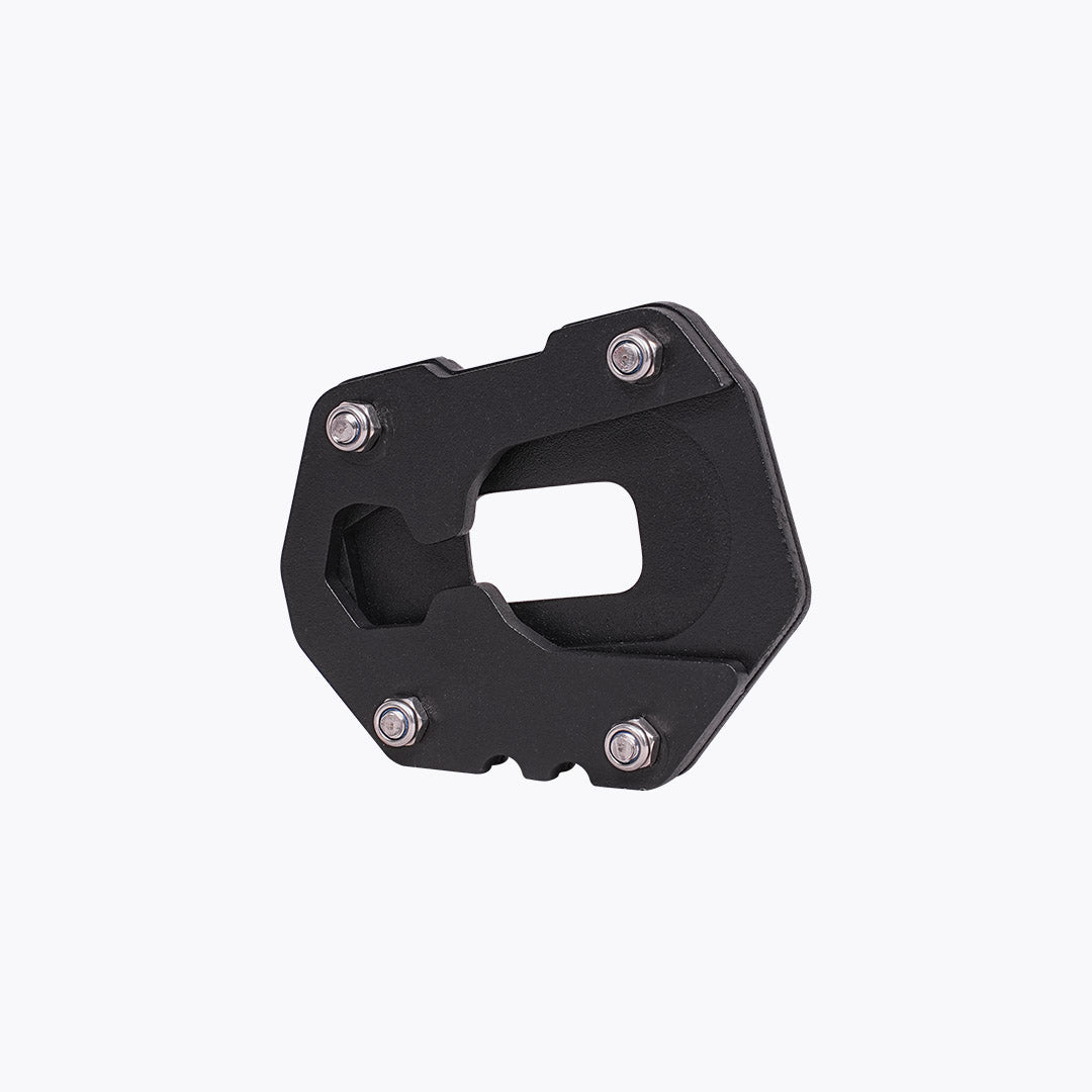 Black motorcycle side stand base plate with mounting bolts on white background
