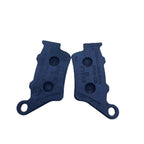 Front view of two black motorcycle brake pads on white background