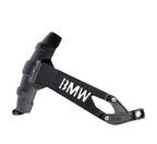 Black metal motorcycle engine guard accessory with BMW logo, isolated on white background