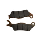 Pair of motorcycle brake pads with textured friction surface, isolated on white background