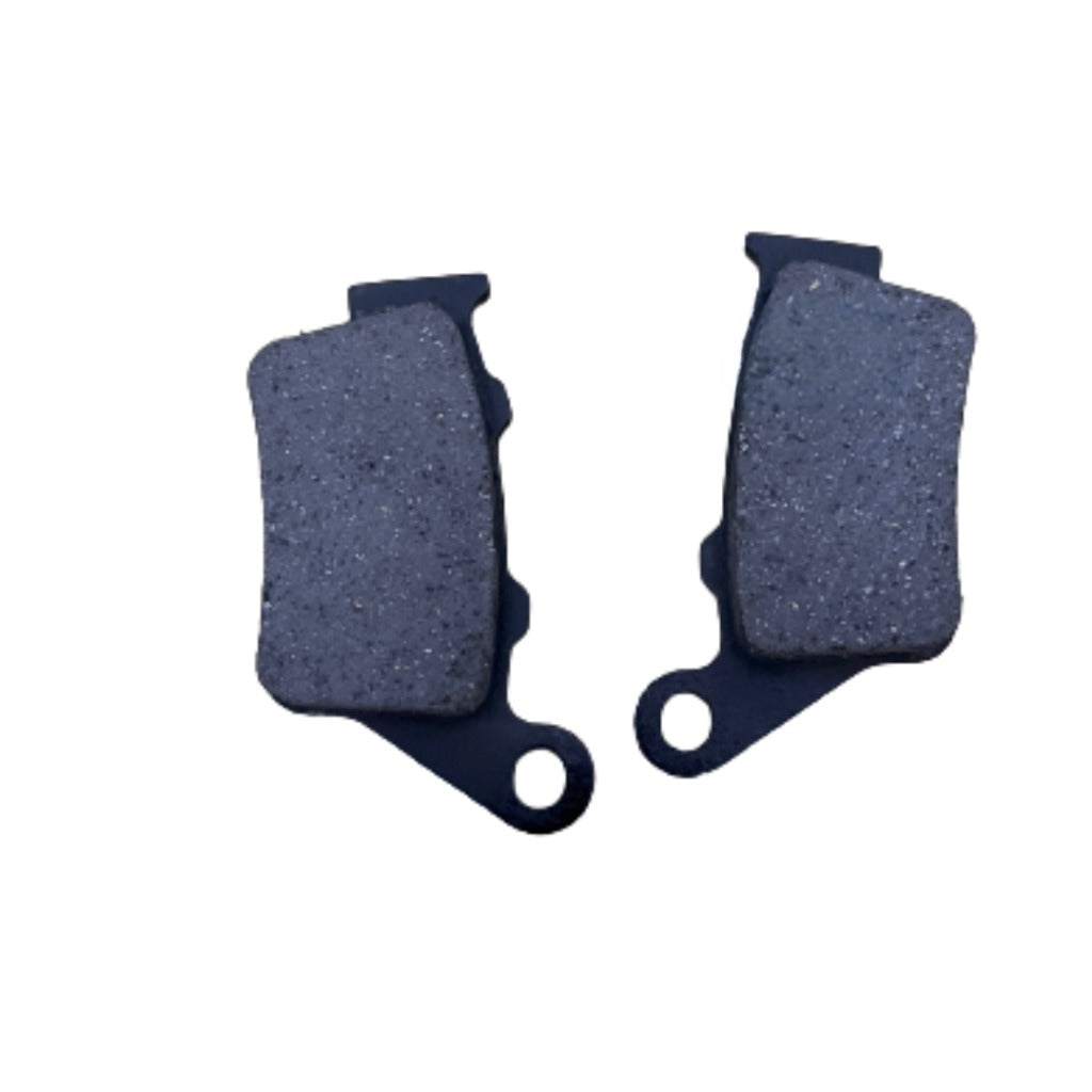 Pair of motorcycle brake pads on white background