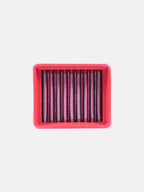 Rectangular red motorcycle air filter with vertical pleats on white background
