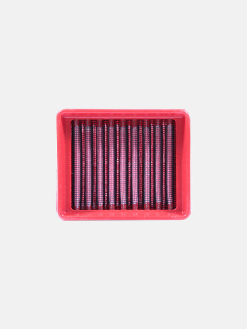 Rectangular red motorcycle air filter with vertical pleats on white background
