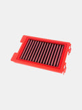 Red rectangular motorcycle air filter with pleated mesh on white background
