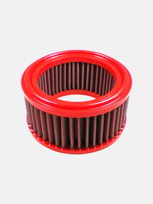 round red motorcycle air filter with pleated design on white background