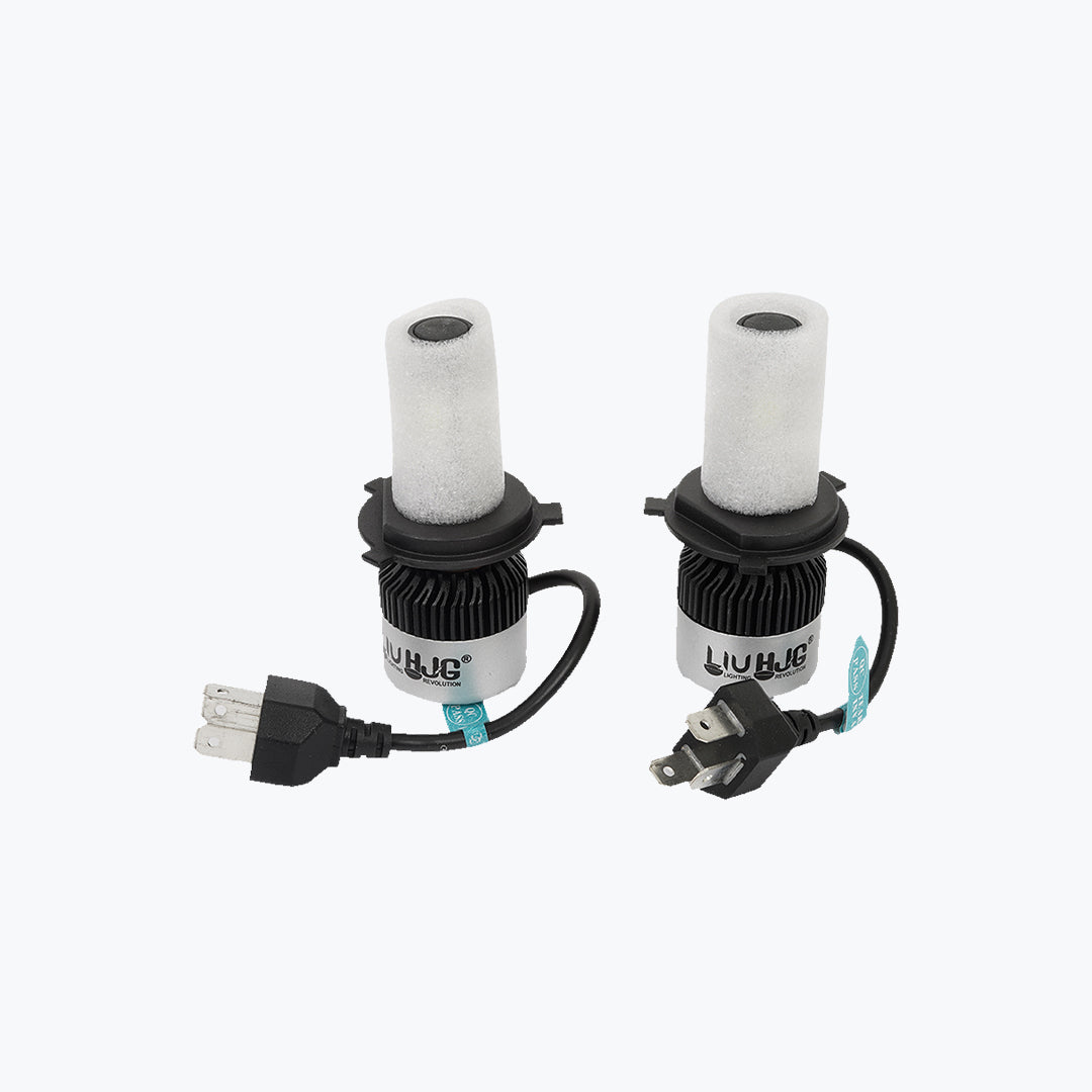 Pair of LED motorcycle headlight bulbs with cooling fans and power cords on a white background