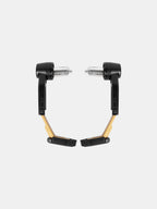 Pair of gold and black motorcycle handlebar guards on white background
