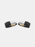 Pair of black and silver motorcycle handlebar end weights on white background