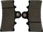 Close-up of motorcycle brake pads pair, new replacement parts on white background