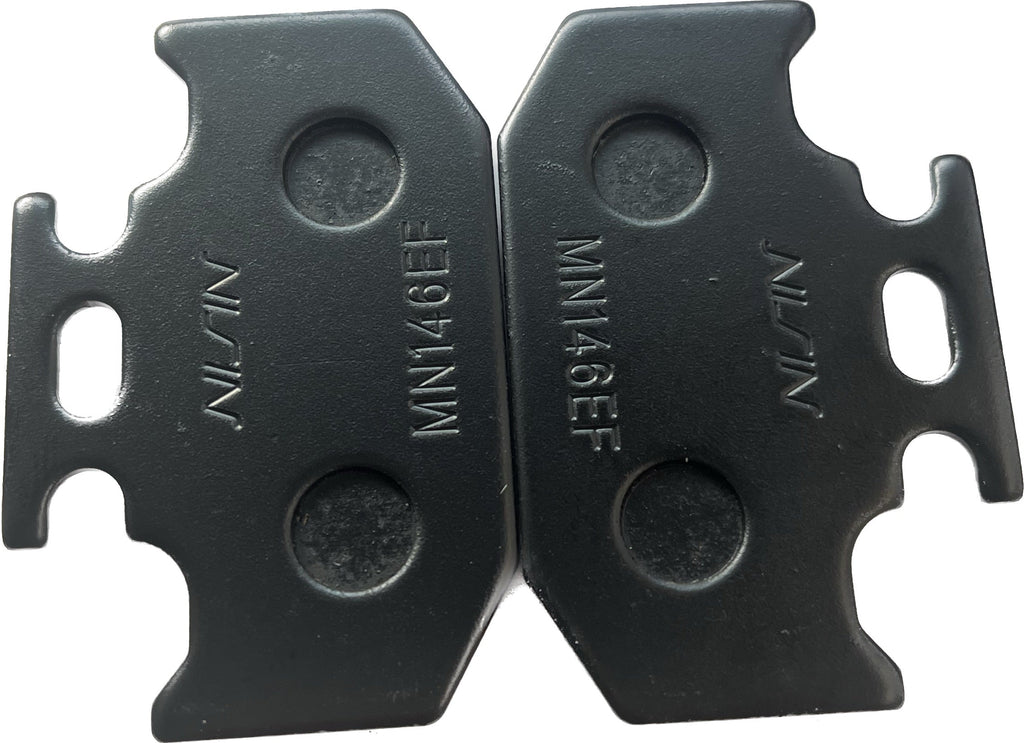 Pair of Nissin MN146EF motorcycle brake pads in black, close-up view