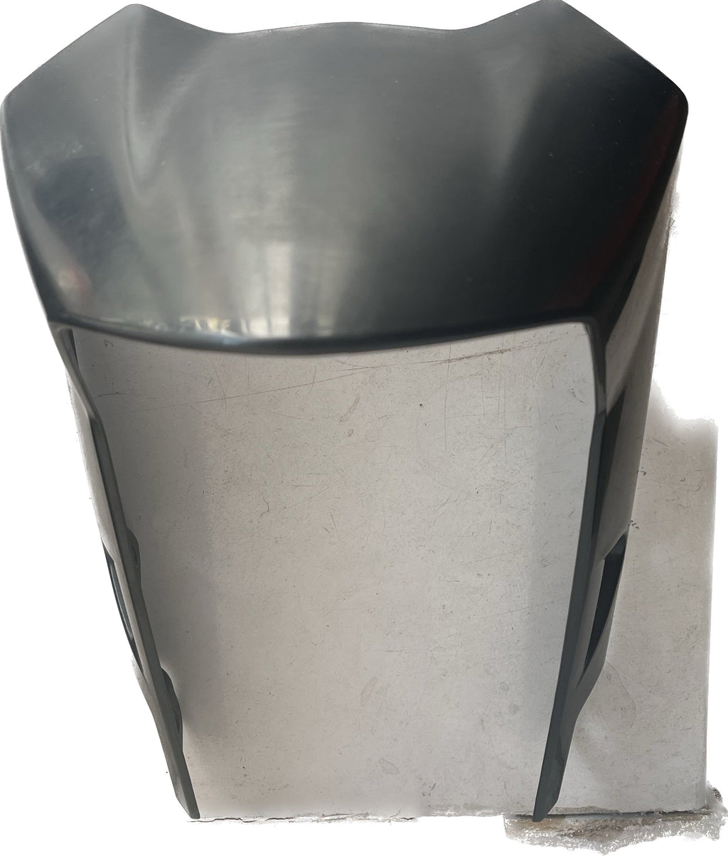 Black motorcycle front fairing or windscreen on a white background
