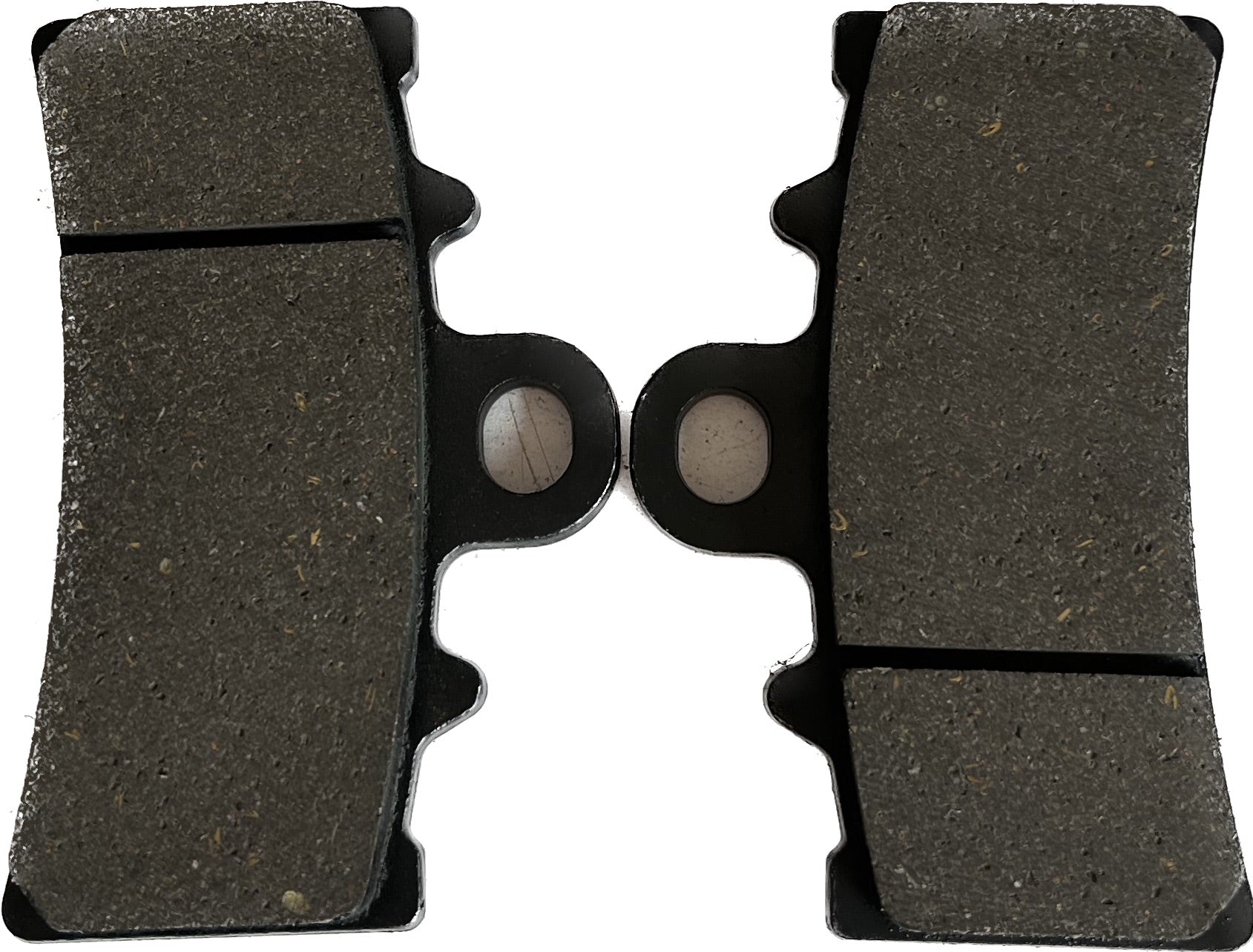 Pair of motorcycle brake pads with dark friction material on a white background