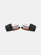 Pair of black and orange motorcycle handlebar end caps with metal bolts on white background