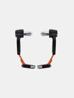 Pair of orange and black motorcycle handlebar guards with metal mounts on white background
