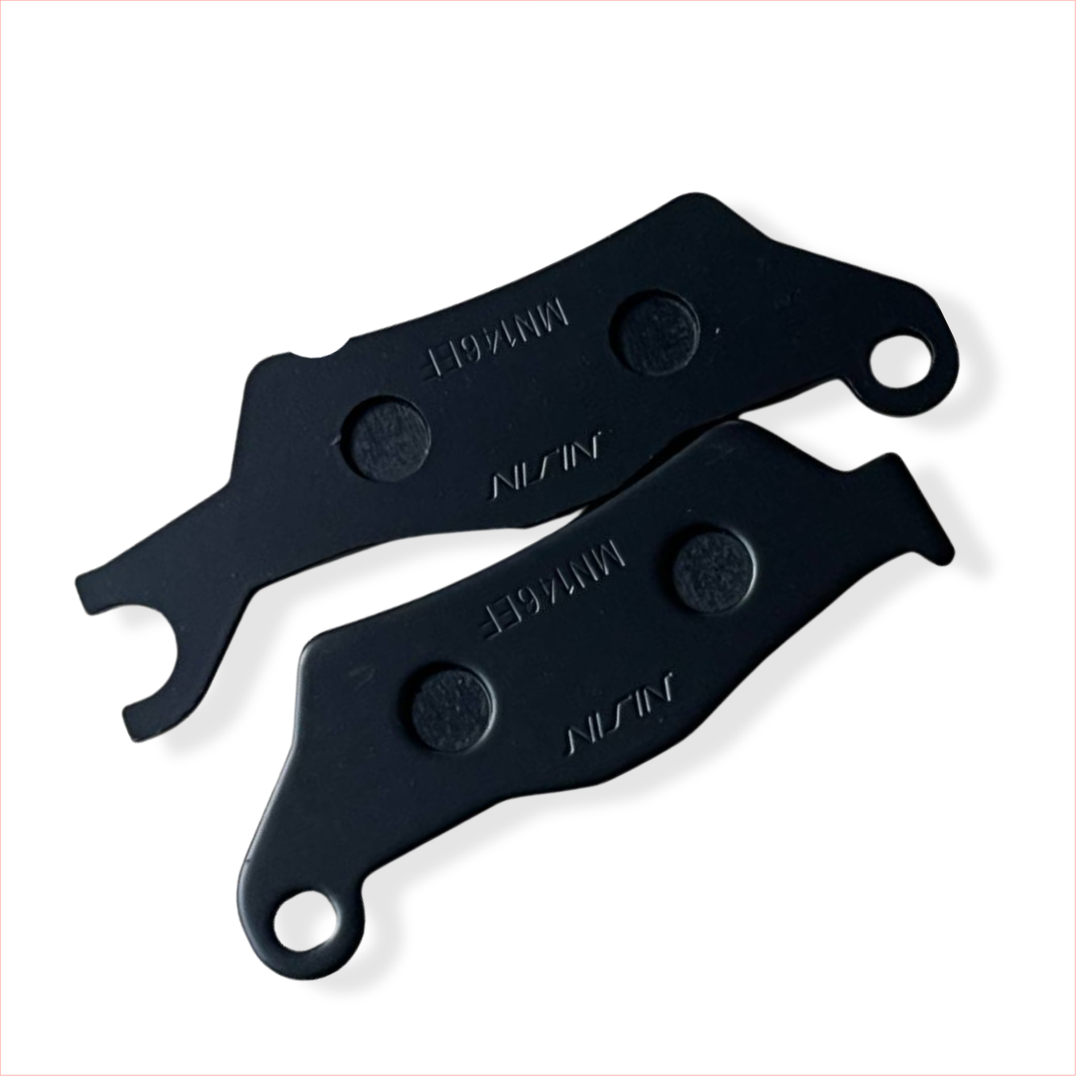 Pair of black motorcycle brake pads labeled NISSIN on white background