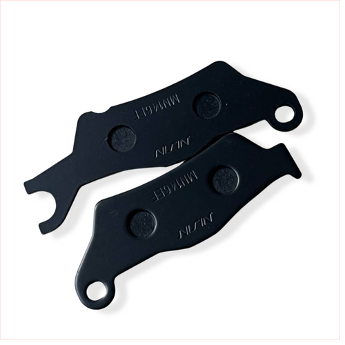 Pair of black motorcycle brake pads labeled NISSIN on white background
