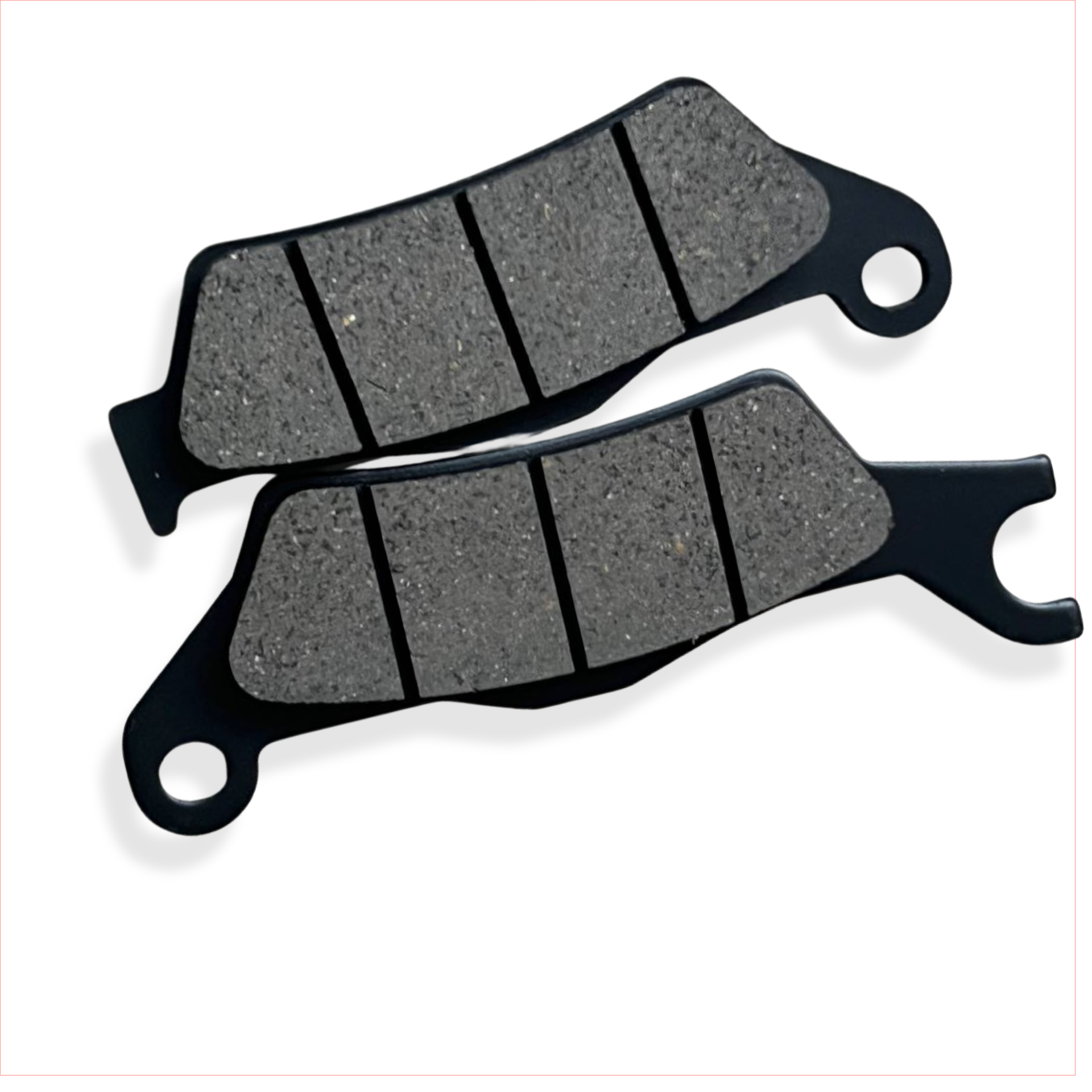 Motorcycle brake pads set on white background, close-up of friction material and grooves