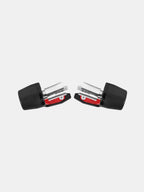Pair of black and red motorcycle handlebar end weights with metal bolts on white background