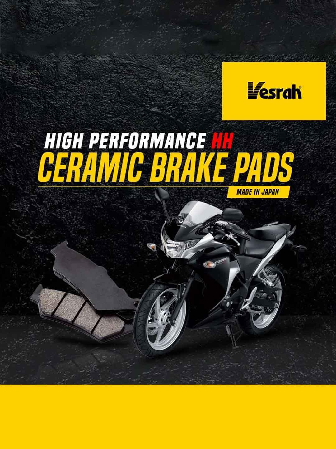Motorcycle with high performance ceramic brake pads on black background, Vesrah logo visible